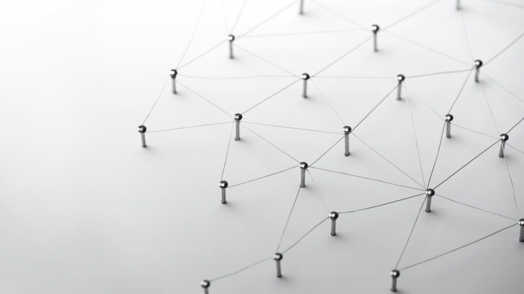 Web of Thin Silver Wires on White Background